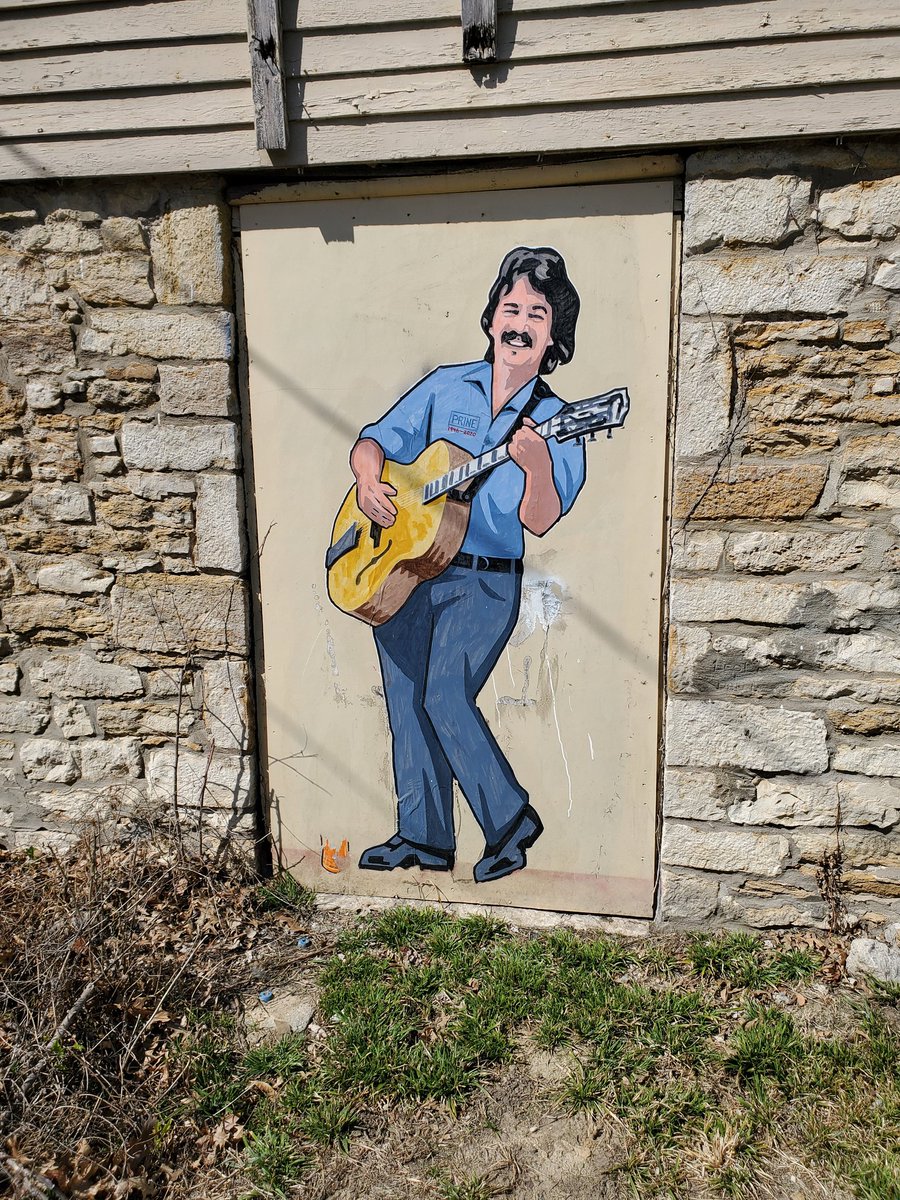 MikeBrunin's tweet photo. Beautiful John Prine mural in East Lawrence, KS. Credit to @LoewensteinDave I believe. @JohnPrineMusic https://t.co/s82IkvO4Lj