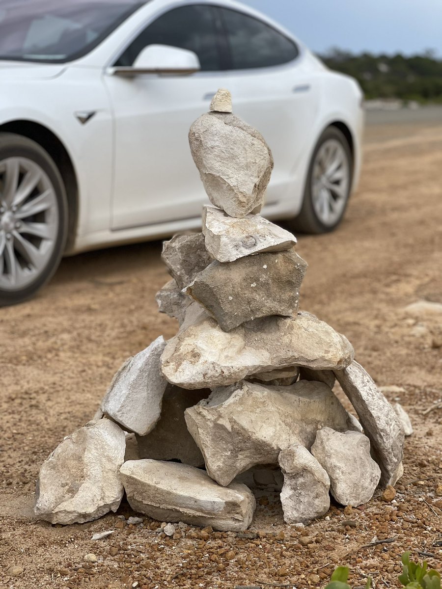 julesboag's tweet photo. Day 22 Around Australia Road Trip in a Tesla. A lazy day around the Jurien Bay Area. Donβt know whatβs going on here but the road to Sandy Cape is a rock stacking Mecca. #tesla #Roadtrip #SandyCape #rocksculpures https://t.co/6lREoz5Lbg