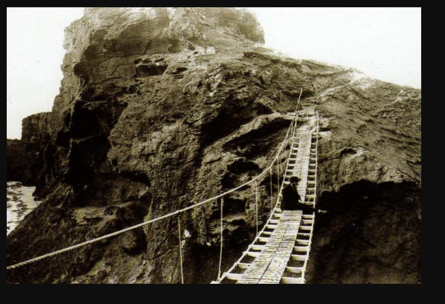 Adrian McKinty on X: @flynnberry_ you'll like this when I was a kid in the  70s/80s Carrick a Rede rope bridge looked like this, a single rope on one  side w no