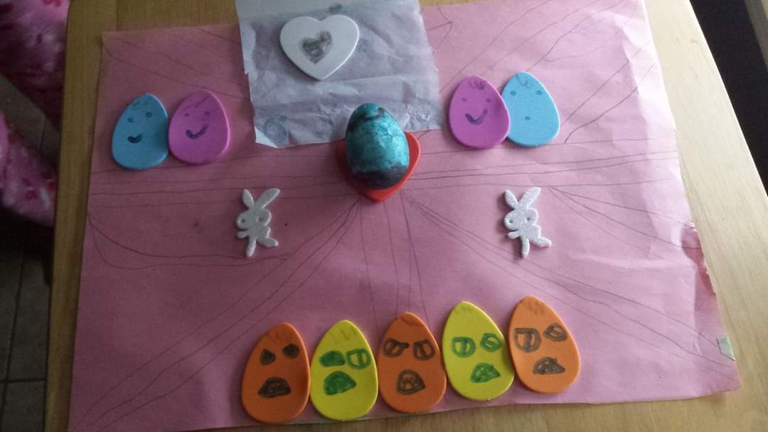 From the album Disturbing Easter Art My Children Gift Me. 
5yr old: "The eggs on the bottom are in the burning fire. The eggs on the top are in heaven and are all smiley at burning eggs. The middle egg was just born &amp; is very special but the fire eggs want it to burn with them."