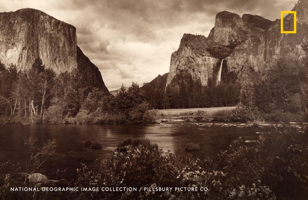 El Capitan, Cathedral Rocks, and Pohono Falls create a majestic scene in this archival image from Yosemite National Park, California.