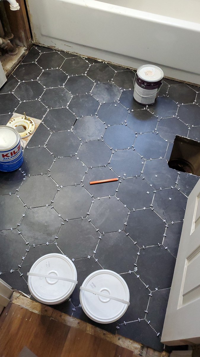 HackerShayne's tweet photo. This weekend we're finally putting flooring down, and while I won't take credit for the significant portion of the work my dad did (partly insisted on because I'm impatient and would have likely fucked it up) Tiles down. Grout tomorrow. https://t.co/v0bgUwz99g