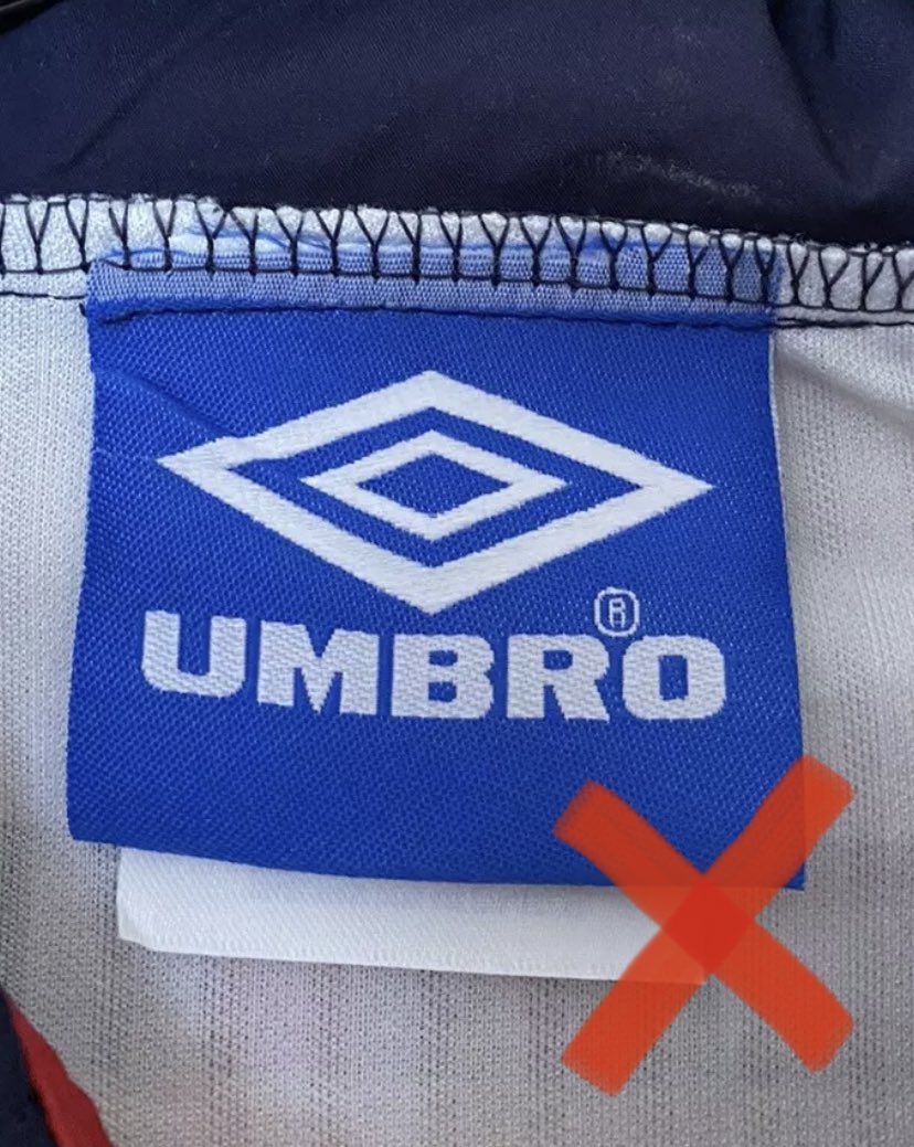 England  1997-99 FAKE out 4 Vapatech tag on reverse, the originals don’t have these (some Umbro  from this era did but not this)Clean Umbro tag, look for the blue dots in the word Umbro as pictured BNWT, multiple sizes available =  RT