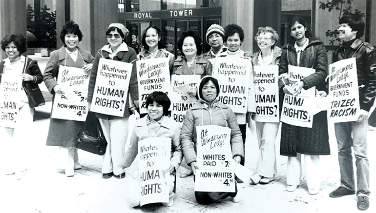 BC_LHC's tweet photo. Striking workers paid a visit to the owner's downtown #Vancouver corporate headquarters, openly accusing them of paying these non-white workers less than the standard rate paid to white workers. (3/4) #canhist #wagediscrimination #LongTermCare #carenotprofits #TDIH https://t.co/5s2484Y7lk