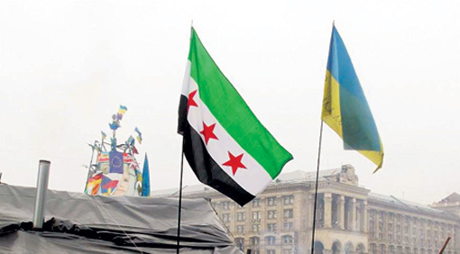 There was also a Syrian revolutionary flag at the Maidan, which probably makes all the protesters headchopping jihadis in tankieland.