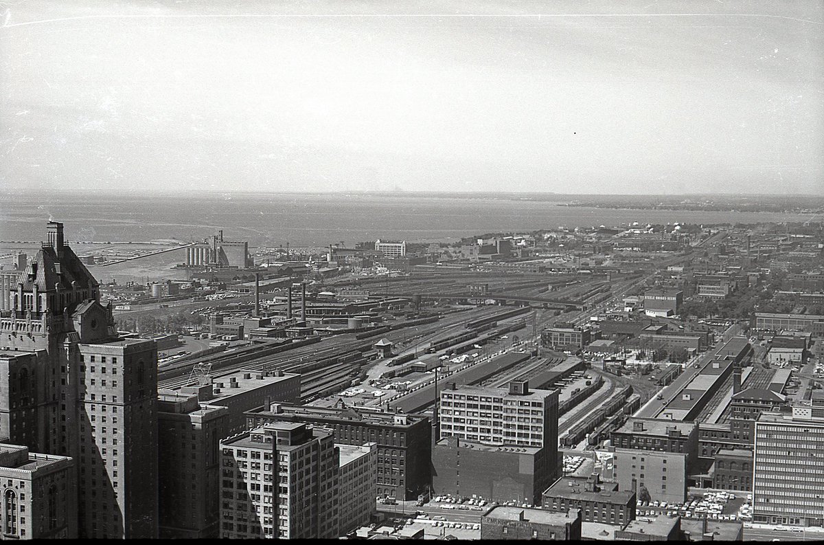  #TPBscan #3A similar view to yesterday’s, but the photographer has zoomed in and the plane of focus has shifted outward, revealing more detail in the mid-ground. For example, you can now make out Maple Leaf Stadium next to the Tip Top Tailors Building.