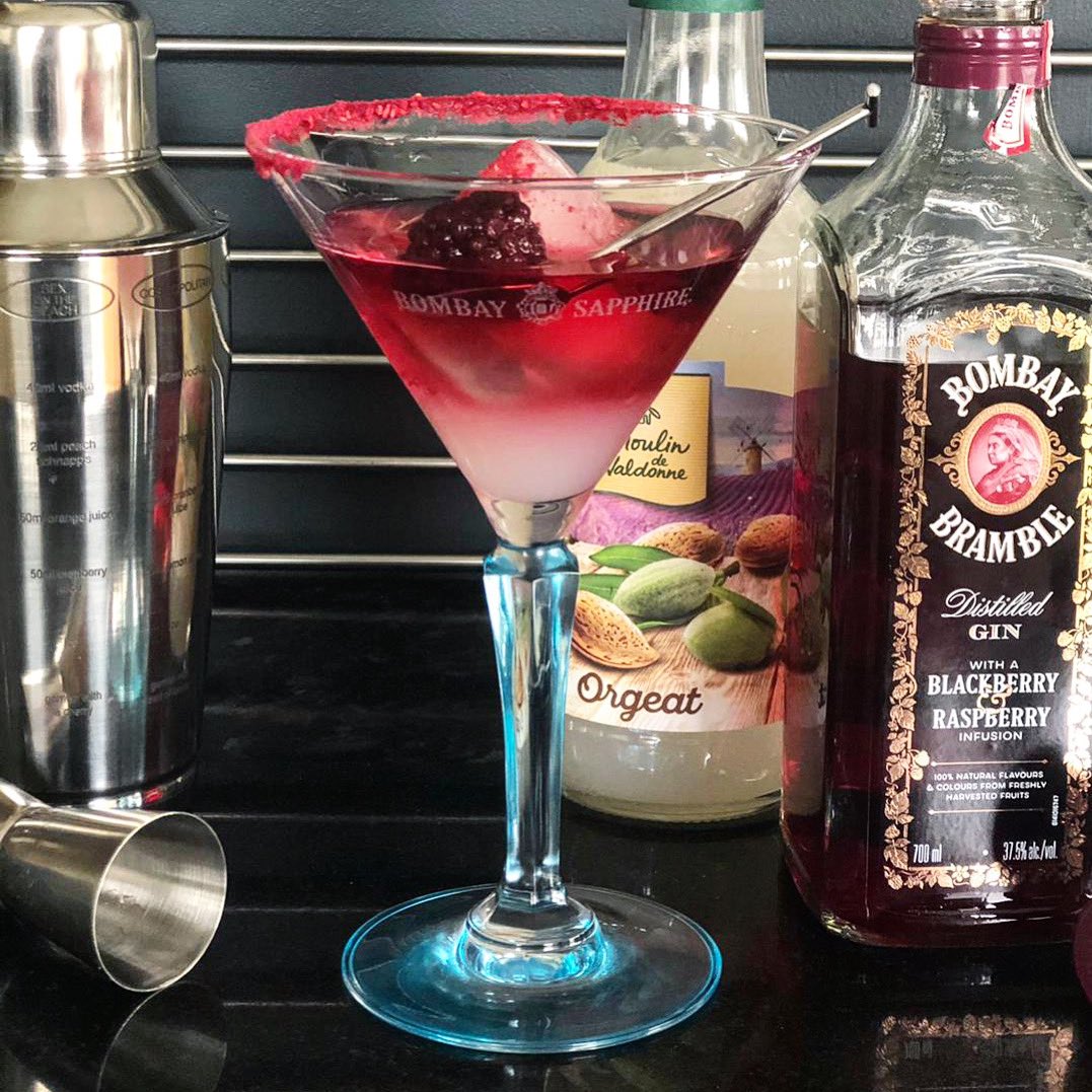 _themixologist's tweet photo. The Berry Bakewell! Firstly rim your martini glass with freeze dried raspberry powder. Layer 25ml of almond syrup with 50ml of @bombaysapphire blackberry &amp; raspberry infused gin, top with a dash of soda water and serve with one large ice cube and a single loganberry 🍇#cocktail https://t.co/D5Fkp1aXI7