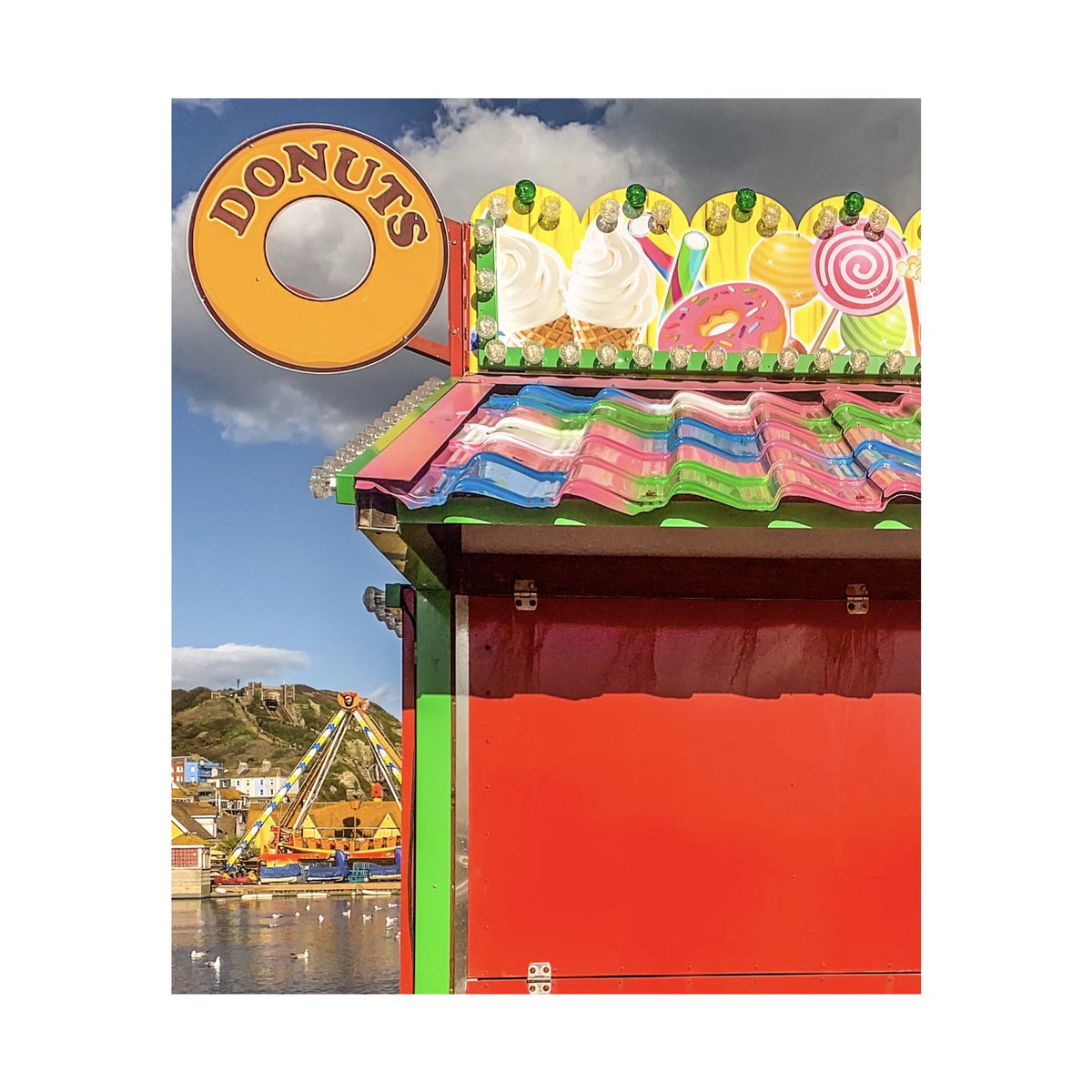 ‘All the fun of the ...You #Donut’  #fairground #fairgroundart #streetphotography #street #seaside #allthefunofthefair #colour #photo #abstract #mobilephotography #wheel #abstract #abstractphotography