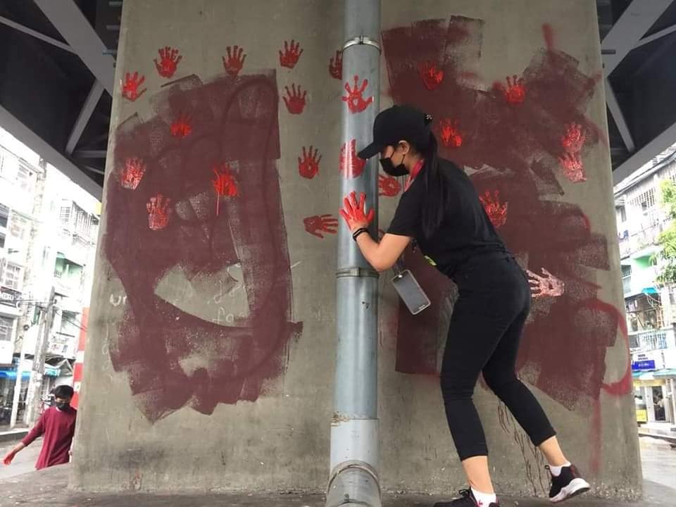 IrrawaddyNews's tweet photo. Young people in Yangon’s Tamwe Township launched a “Blood Strike” on Tuesday, spraying red paint, symbolizing blood, in public places to honor fallen anti-coup protesters and express their continued defiance of the military junta. (Photo: CJ) 
 
#WhatsHappeningInMyanmar https://t.co/kUaUT22y4w