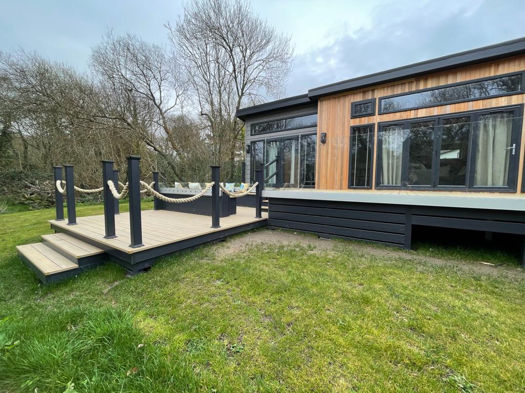 mayfielddecking's tweet photo. WOW! The final result of this installation at @shorefieldholidays 😍 This bespoke deck features a viewing pontoon, sunken seating and ClearView glass balustrades to maximise the space ☀

Well done to the team for this installation! 👏

#upvcdecking #bespokedesign #outdoorliving https://t.co/creCKNyLnC