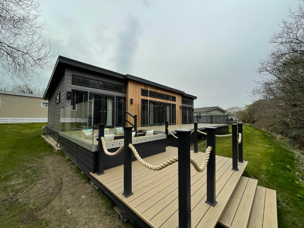 mayfielddecking's tweet photo. WOW! The final result of this installation at @shorefieldholidays 😍 This bespoke deck features a viewing pontoon, sunken seating and ClearView glass balustrades to maximise the space ☀

Well done to the team for this installation! 👏

#upvcdecking #bespokedesign #outdoorliving https://t.co/creCKNyLnC