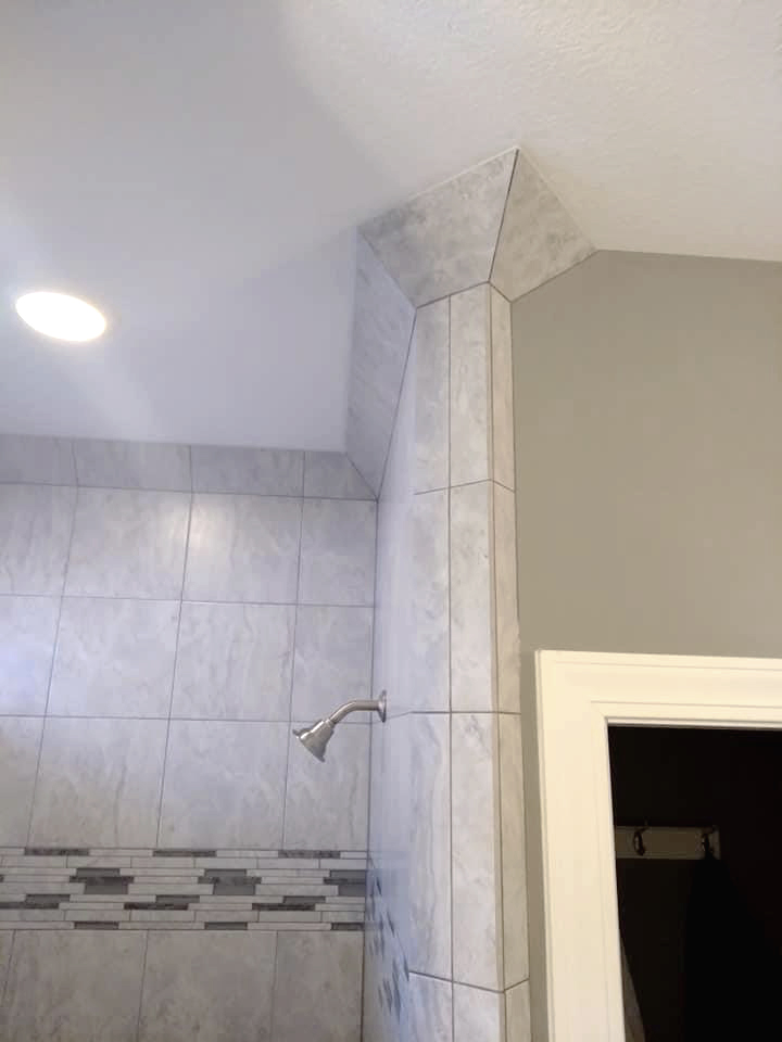 Tile idea! 💠💡 Miter some tile to fill the corner where wall meets ceiling for a custom crown molding look.