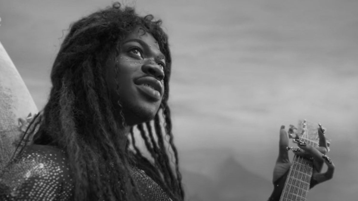 my great grandmother playing guitar at woodstock (1969)
