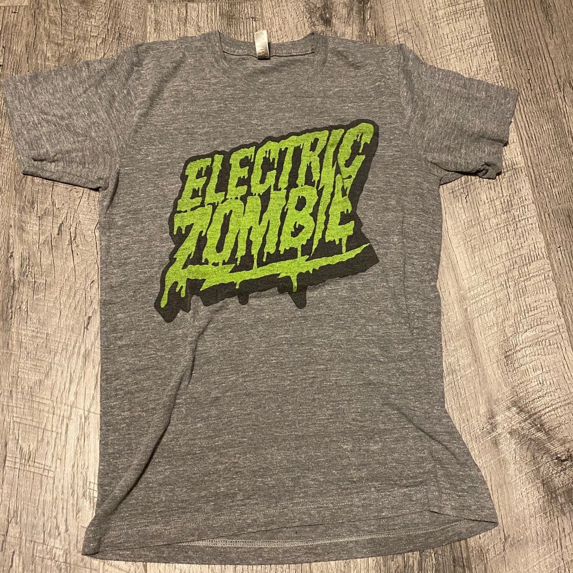 CanChrisHero's tweet photo. @YesManBrad Hey dude! So I’d had my “Death of CH” design for a couple years. There was a shirt I was wearing a ton at that time from the kickass Electric Zombie brand &amp; I loved the look. I mashed up the two shirts &amp; voila! https://t.co/ZAns8lhRD4