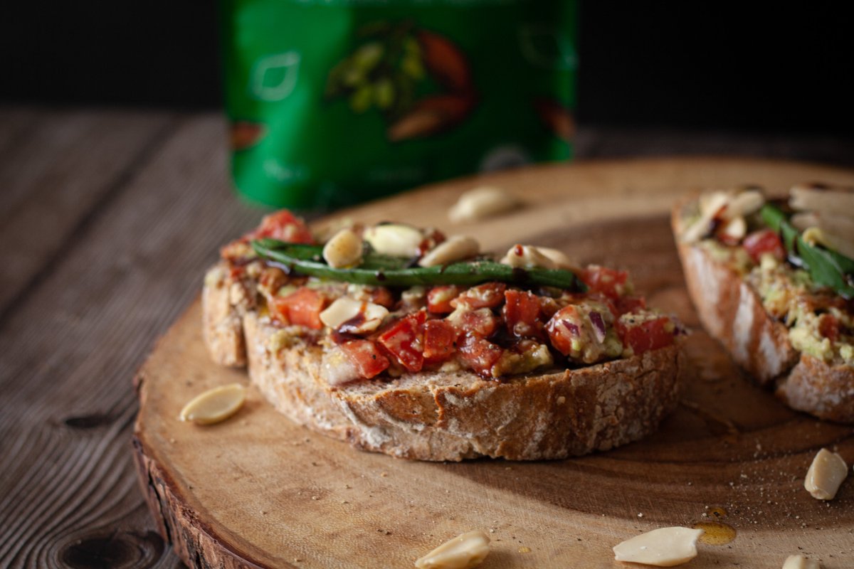 This easy vegan bruschetta features with sourdough, guacamole, olive oil and basil for the perfect 

Italian-inspired appetizer topped with pili nuts.
