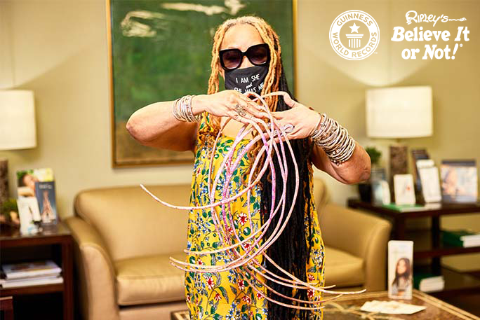 Woman with world's longest nails cuts them after nearly 30 years