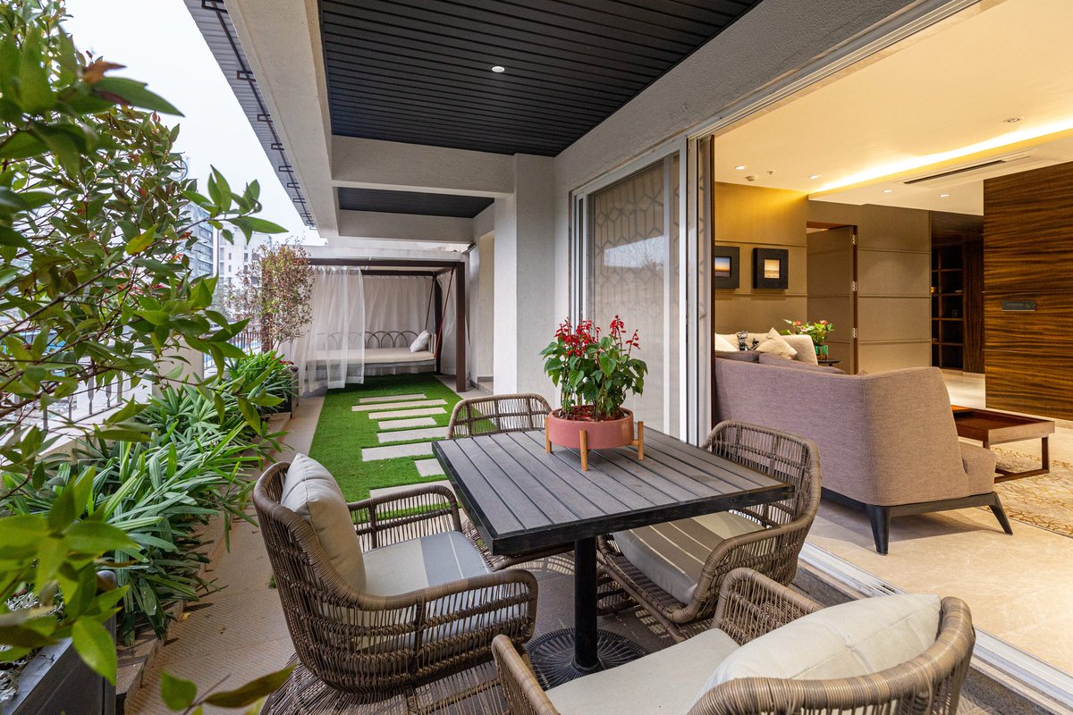 rsa_architect's tweet photo. This terrace garden initiates a peaceful transition to tranquility in a time where urban spaces are loud and disorienting. The table and relaxing chairs being the focal point here allow the viewer to take in the other elements like the day bed and the plants at their own pace. https://t.co/RfhrmMiXcN