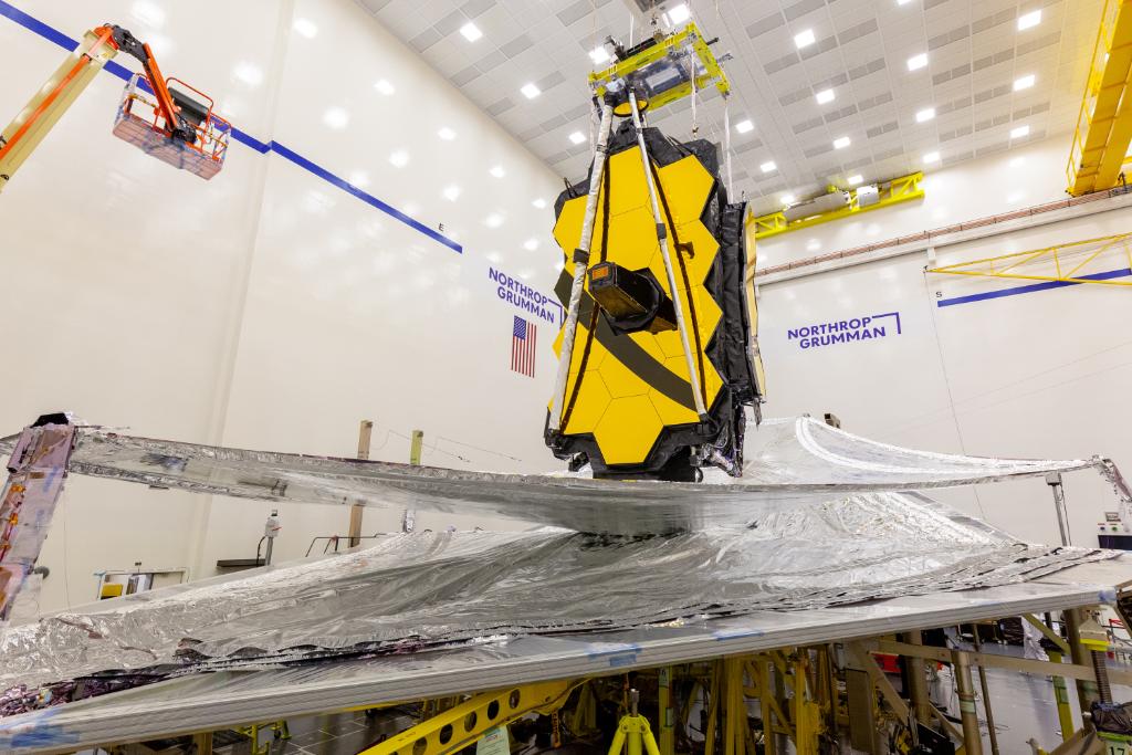 The layers of the James Webb Space Telescope's sunshield are laid as flat as possible as preparation for its folding. In this image, all of the layers except for the top layer have been flattened.