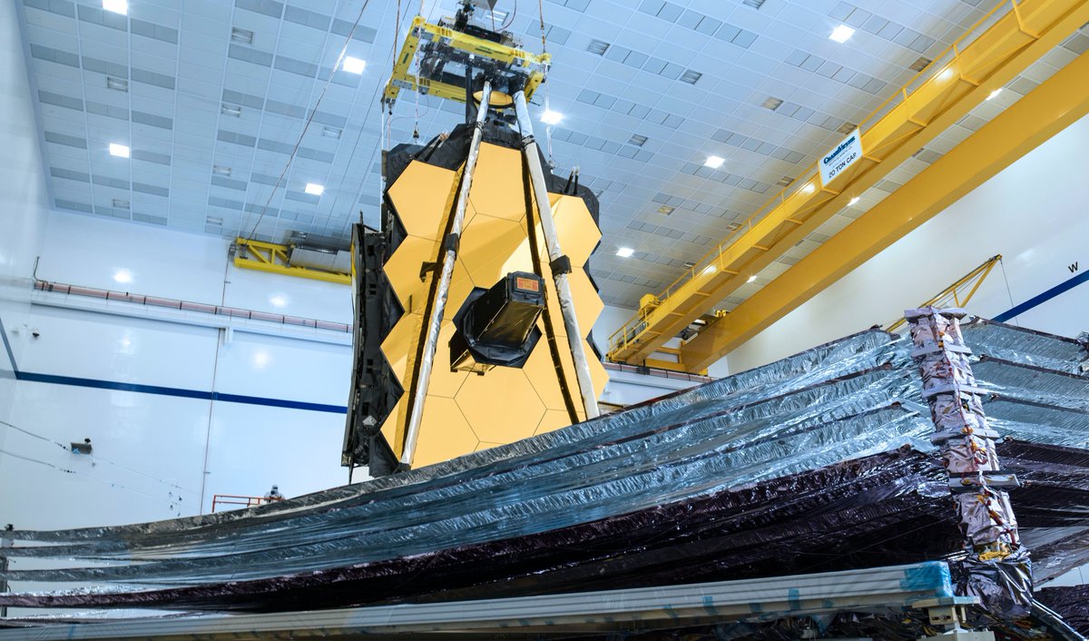 The silver and purple metallic sunshield of the James Webb Space Telescope, shown during deployment testing in 2019.