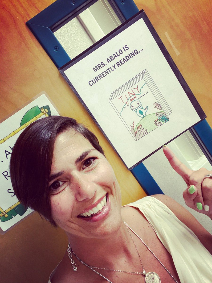 Mrs. Abalo is reading Tiny the T. Rex and the Impossible Hug by Jonathan Stutzman. Lake George teachers are also participating in National Library Week and have decorated their book covers and posted outside their classrooms and offices.  Our scholars are loving them!  #OCPSreads