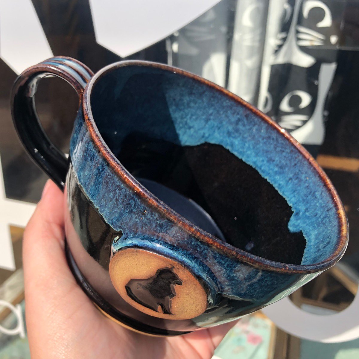 MAUHAUScafe's tweet photo. New mugs are hitting the shelves tomorrow! We still have our classic ivory but we now have a black and blue combo that we think turned out beautifully! *In store only* https://t.co/HF8D1sQB7w