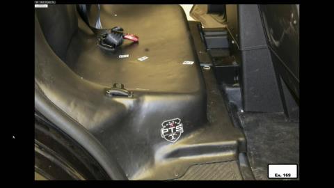 Frank now asking Anderson about the white spot seen near the center console in this photograph. It was initially covered by a shoe. "At the time I didn't give it any forensic significance," she says.