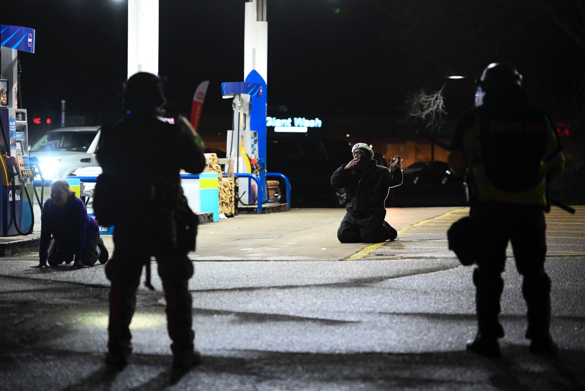 ADLavinsky's tweet image. A man took a drag from his cigarette as he was told he was under arrest by State Troopers in the Pump N Munch parking lot in Brooklyn Center, Minn earlier tonight.  @StarTribune
