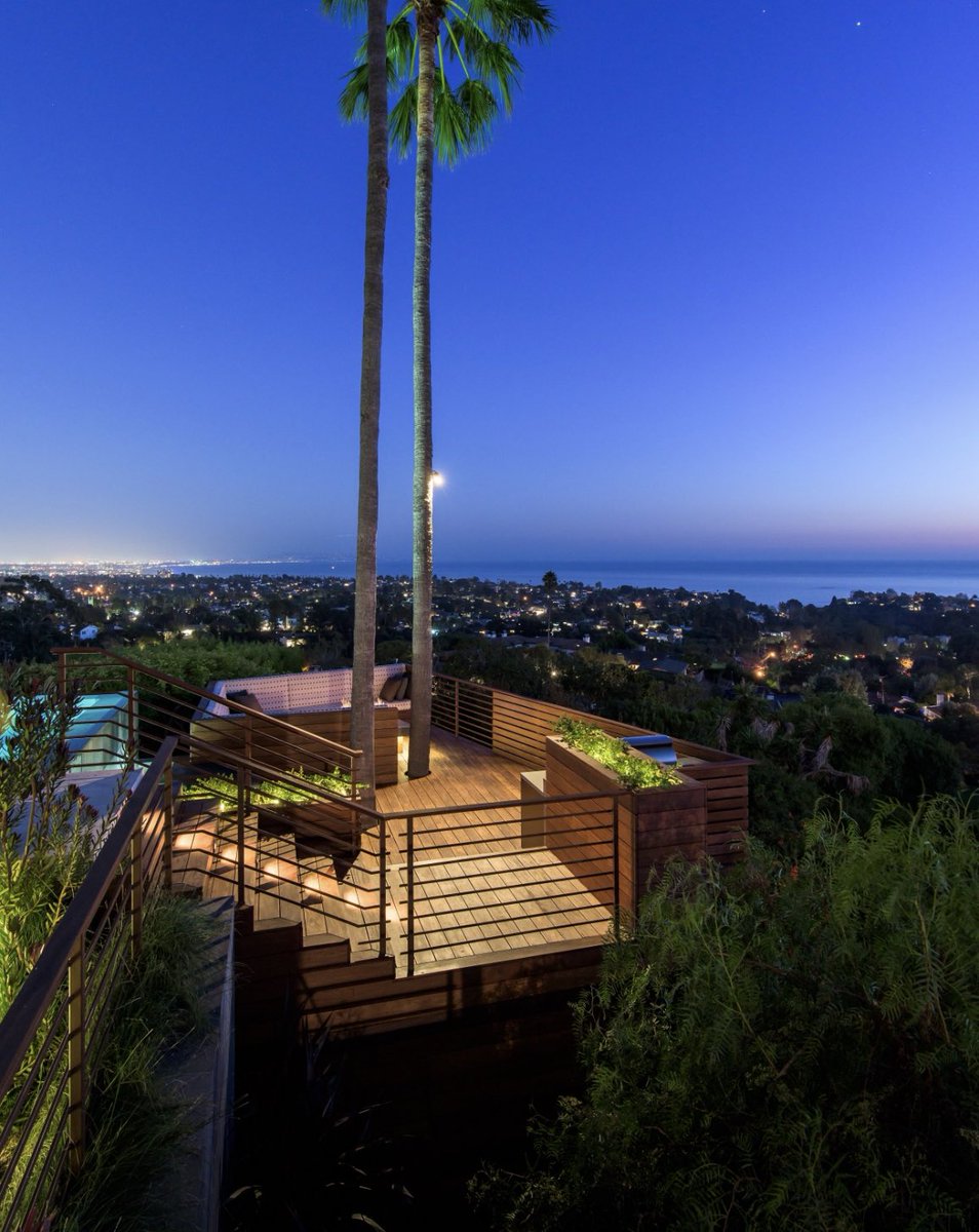 The Las Canoas firepit deck floats over the hillside with evening views to the ocean and the city 
#pacificpalisades #architecture