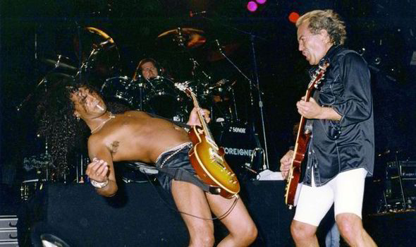 ronwikso's tweet image. Here's a pic I'd never seen B4 but I remember the show. It's @Slash, me &amp;amp; @TheMickJones when I was w/@ForeignerMusic in 1996 &amp;amp; Slash sat in with us. We toured w/@kcreospeedwagon &amp;amp; @peterframpton. This was Phoenix, AZ in summer, a million degrees (outdoor show), hence the shorts.