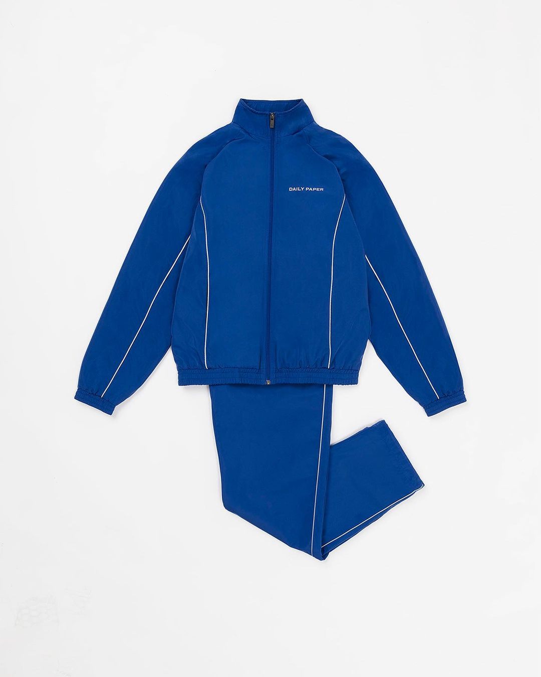 Daily Paper on X: "Training essentials. The tracksuit, crafted from a technical nylon with piped trimmings. Discover the Mazarine blue plus other colour ways online and in store: