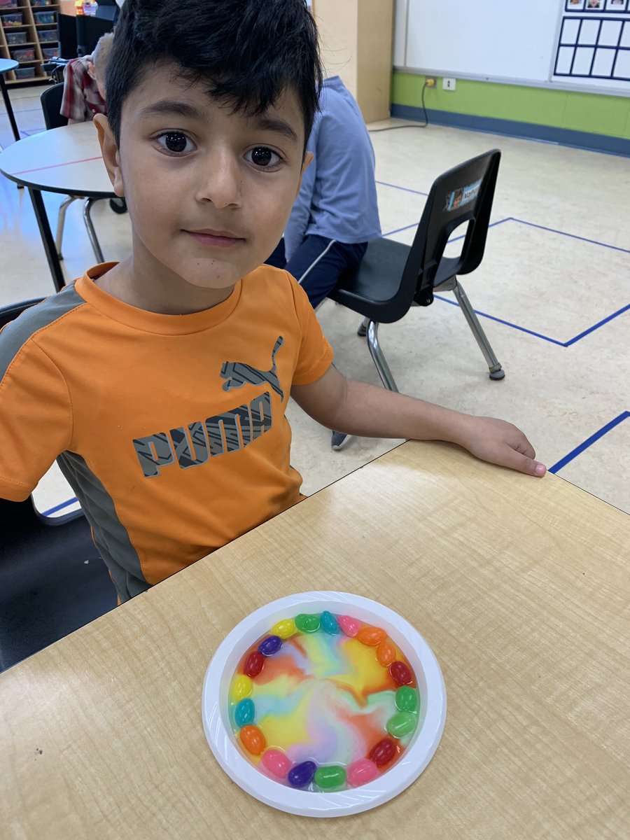 bluecastle24's tweet photo. What happens when you put jell beans around the edge of a plate and add warm water? The colours start to spread! @QEPSKnights https://t.co/HOMKCzPAoG