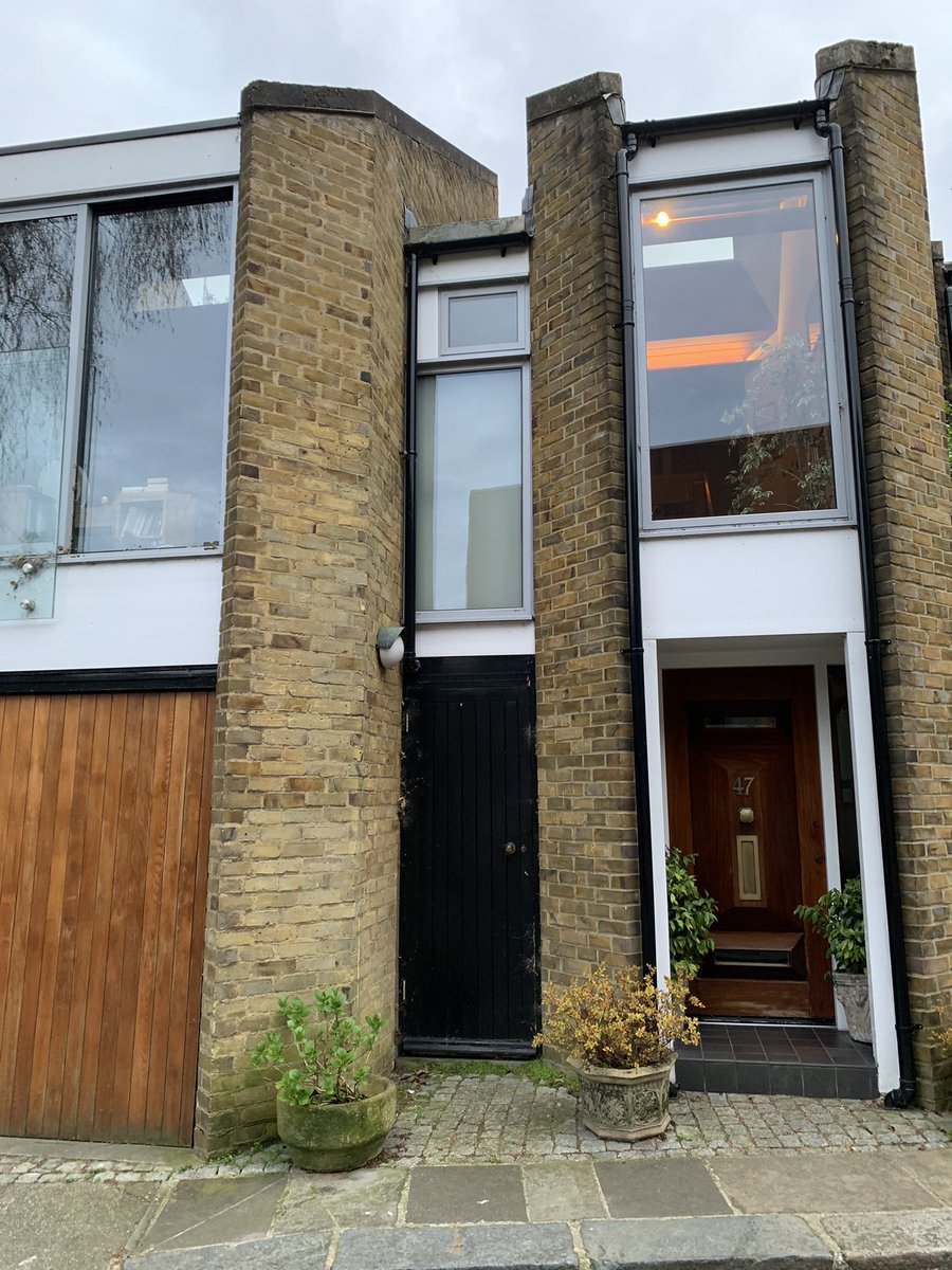 This house in Primrose Hill is my win-the-lottery fantasy. There’s a cat sleeping in the floor length window. And a shield attached to protect the ample library from direct sun. I love doorknobs in the middle of doors. Friendly post-70’s Brutalism of dreams: