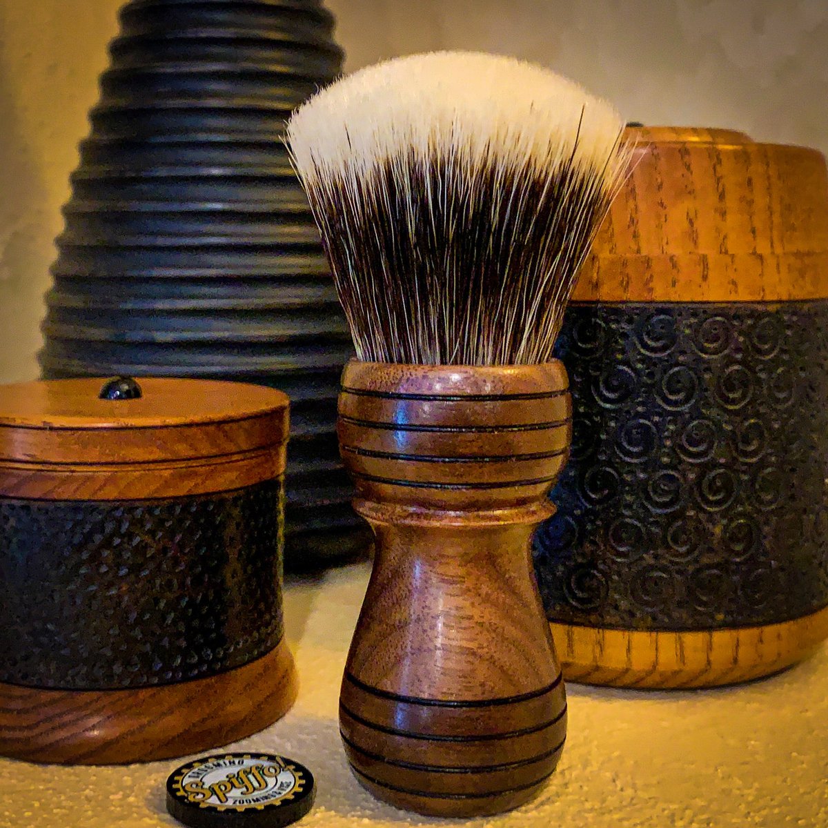 Spiffoman's tweet photo. Caluum, a solid Black Walnut shaving brush with its ringed handle and 24mm super high-density Manchurian Two Band badger knot, is standout elegant in its simplicity! #wetshaving #shaving #spiffo #traditionalshaving #shavingbrushes #shavingbrush #oldschoolshaving #spiffoman https://t.co/lx7pfIDKC6