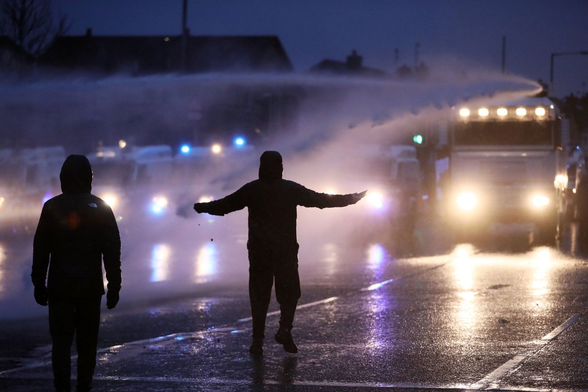 Youths not frightened by PSNI water canons tonight on Springfield Rd.   @presseyephoto