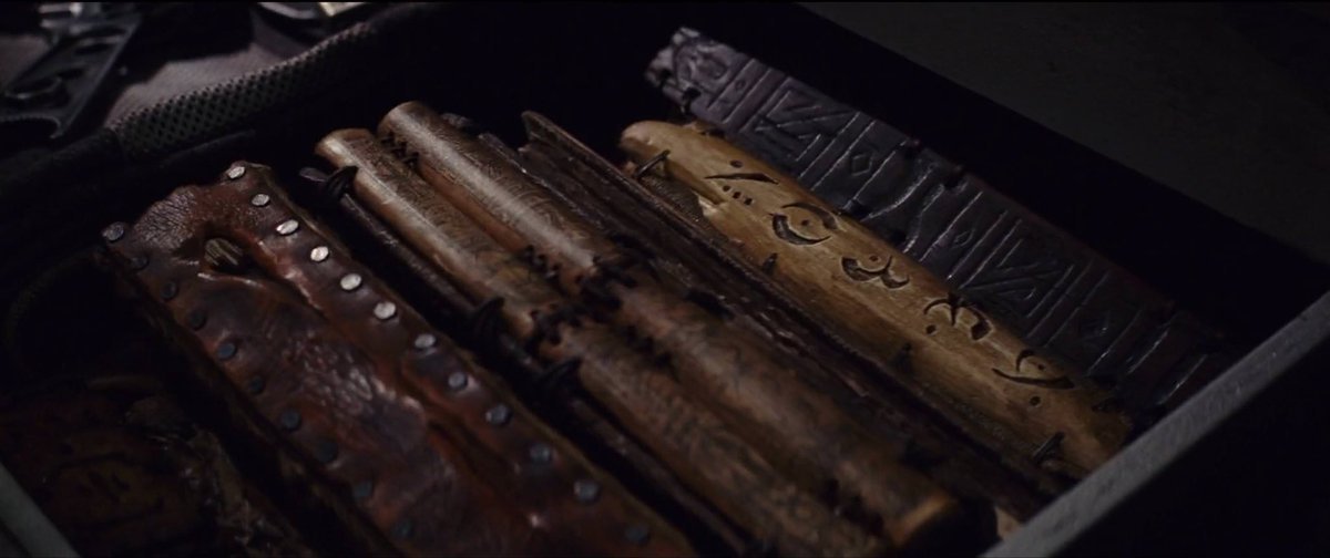 The book justifies Rey's taking the books as her scavenger instincts taking over. In any case, she saved them from the burning.She knows they are not containers of any ultimate truth, but values their place in history. She's lost hours reading through them.