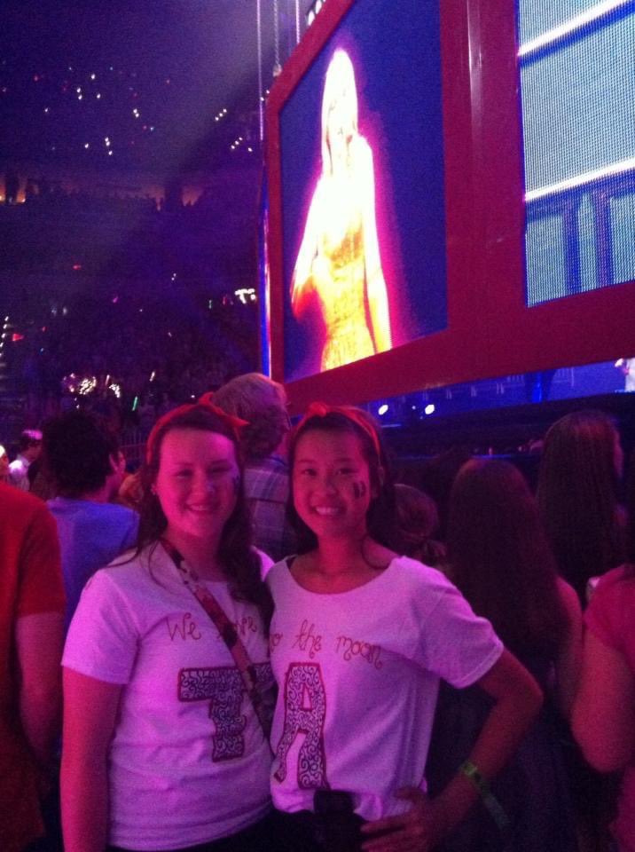 RaeRaeLuo's tweet photo. In honor of Tay Swift’s release of her version of Fearless, here’s a pic of when Kass &amp; I peaked in our life. 

At her Red concert when we got free pit tickets. We really did wear customized T-shirts &amp; matching outfits. I really did spend hours using black gel pen on the shirt. https://t.co/q09gd5Cz7l