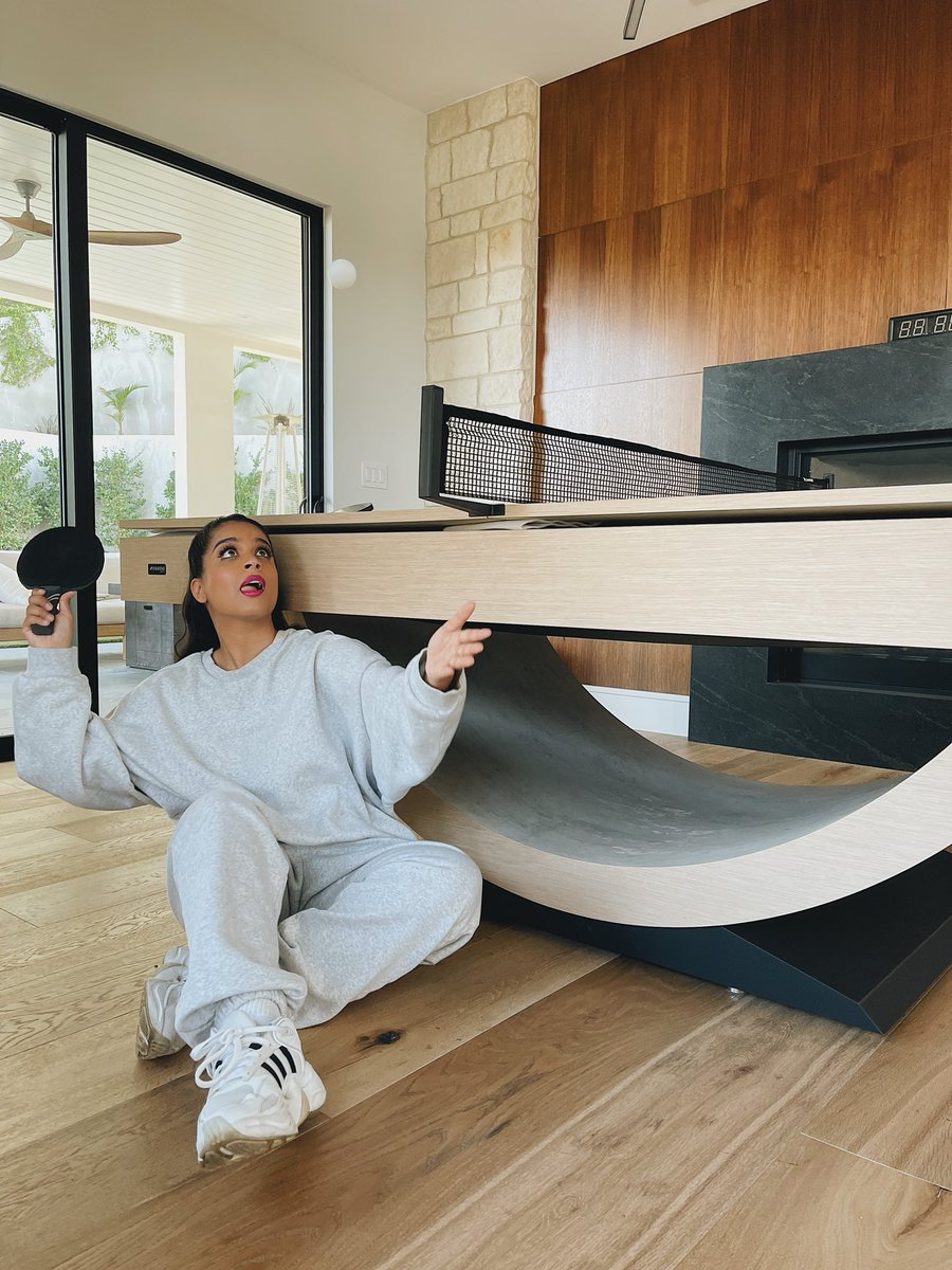Lilly's tweet photo. After being on my vision board for 5 years, I finally got myself an 11 Ravens custom pool/ping pong/ dining table and I couldn’t be nerding out more. @humblethepoet lmk when you wanna get whooped. #ad https://t.co/X762y20WFk