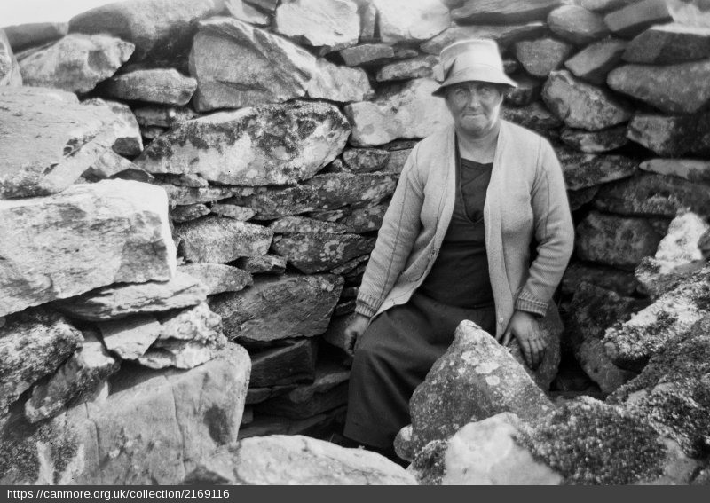W2000K's tweet photo. A recently digitised image from the collection of J Symington Grieve in the #hesarchives showing 'Miss Mckechnie of Crinan Harbour' at Castle Dounie, Argyll, in 1926! #canmore #archaeology #hes https://t.co/ATqVPqXldD