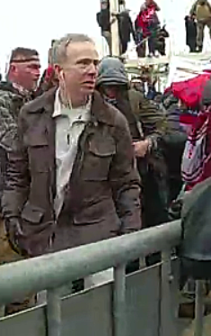 FBI's tweet image. The #FBI continues to seek information on individuals involved in the violence at the U.S. Capitol on January 6. If you think you know the person in these photos, submit a tip at tips.fbi.gov. Refer to photo 294 in your tip.