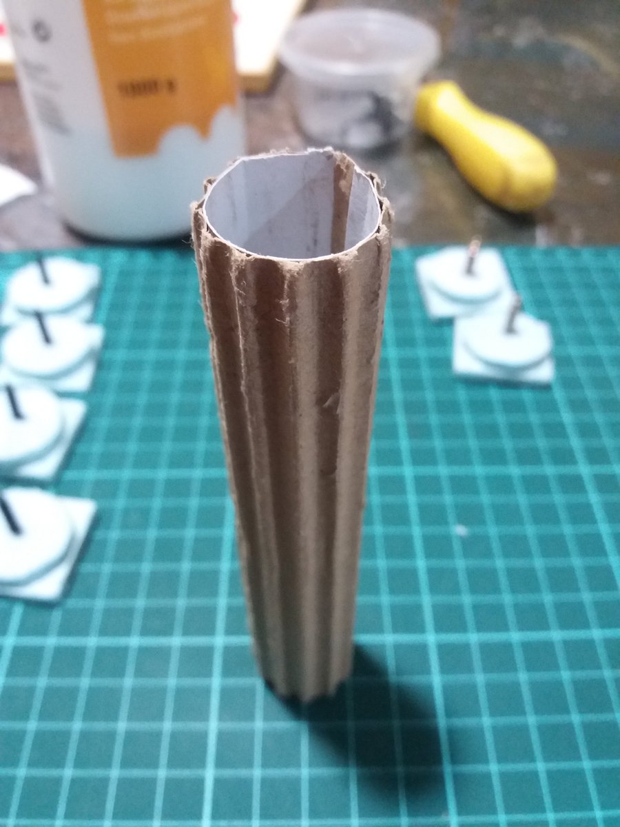 For the actual pillars, all you need is some corrugated cardboard peeled on one side. Decide how tall and wide you want yours and cut rectangles of the peeled carboard. Then glue one end to the other with just a little PVA glue to get a cilider, making sure you hide the seam.