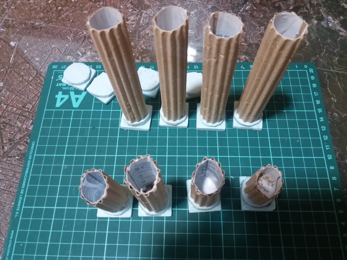 I recommend cutting whole pillars at this point to make two broken ones with ease. Glue them to the heavy bases with a bit of PVA. Make sure you safe the bases without a screw for the top of the unbroken columns. Once dried I added some coarse sand and a dab of PVA to lock it.