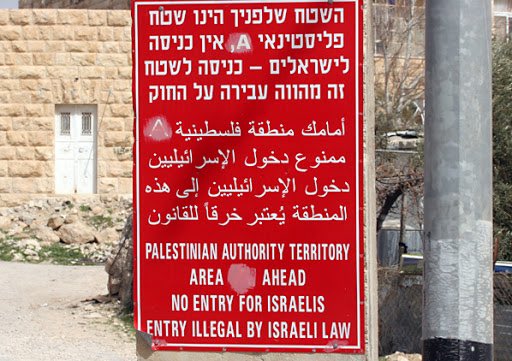 It is interesting to note that the image posted by  @GoldsteinBrooke is one of the latest iterations of the sign which were updated in order to obscure the facts and simply provide an ominous and rather racist warning to Israelis... the older version of such signs is attached.