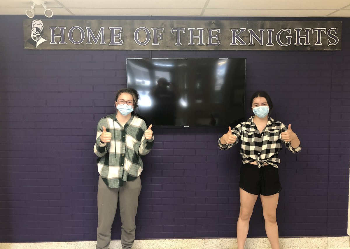 Two of our talented Grade 8 student artists proudly showing off the sign they created that now hangs in our refurbished lobby.  Thanks for the legacy you have left us on behalf of your grade 8 classmates!