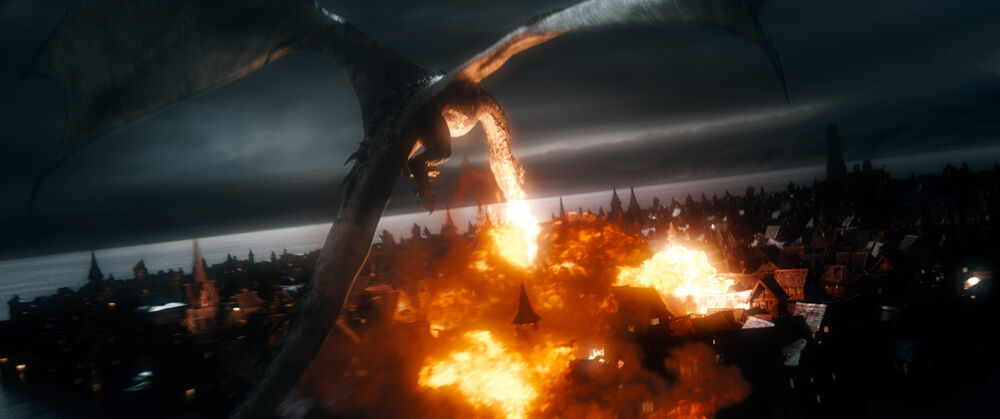 smaug goes outside of his cave, and begins burning down the city. like, burning the city to the ground.