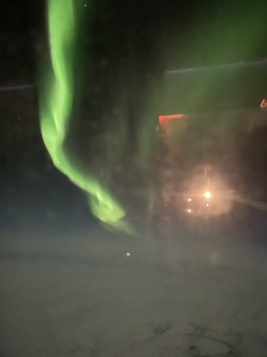 Cosmologist's tweet photo. Recent shots from a mucky plane window over  Winnipeg. My first sightings! None of the dots are stars, they are all reflections from inside the plane. #Auroraborealis https://t.co/knEfpzSDh5