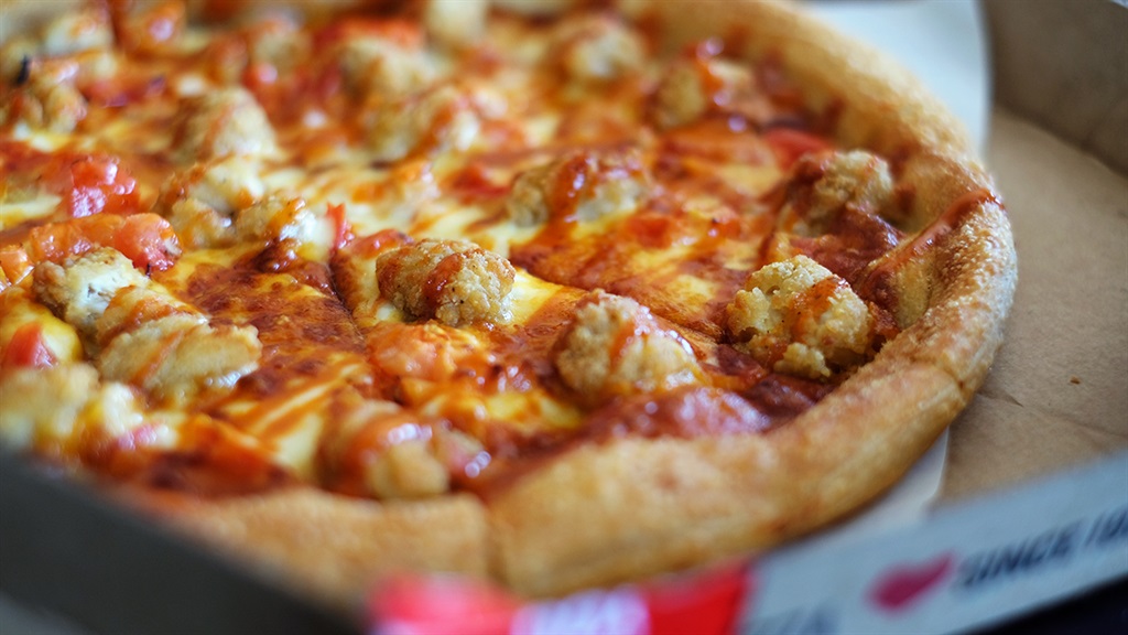 News24's tweet photo. We tried the new KFC pizza at Pizza Hut – and were left with more questions than answers | @BISouthAfrica 

https://t.co/FwEJLbAddS https://t.co/qqD83zUH2F
