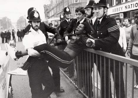 Brixton police station known for beatings given to local black youth. The New Cross Fire, where 13 young backs died, was on many minds. No one ever brought to justice for it (Fire widely thought to be done by fascists). Notorious 'Swamp 81' in Brixton exacerbated tensions.