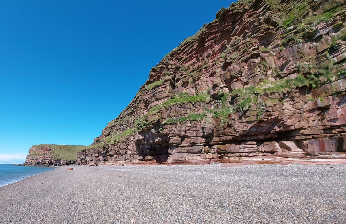 ~230 million years ago the UK was a harsh environment in the middle of the supercontinent of Pangea. Storms over mountains to the west caused flash floods, eroding sediment onto a river floodplain. Today these form rocks of the St Bees Sandstone exposed at Fleswick Bay, Cumbria.