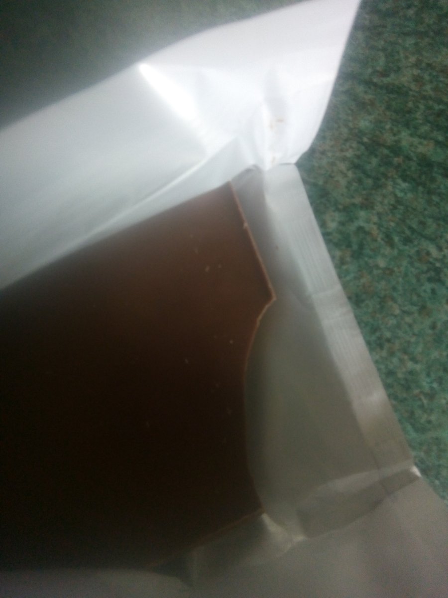 AvaApril15's tweet photo. Thought I'd try the new orange @CadburyUK chocolate bar, opened it and some was missing �� is this a secret competition I've won 🤣😂. Glad I brought two now 🙈😆 @Tesco https://t.co/b686izjouy