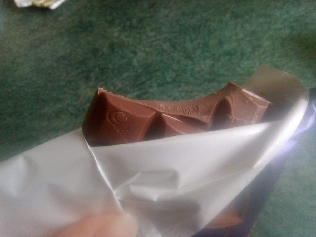 AvaApril15's tweet photo. Thought I'd try the new orange @CadburyUK chocolate bar, opened it and some was missing �� is this a secret competition I've won 🤣😂. Glad I brought two now 🙈😆 @Tesco https://t.co/b686izjouy